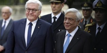 German President Frank-Walter Steinmeier, left, and his Greek counterpart Prokopis Pavlopoulos review the Presidential Guard during a welcome ceremony at the Presidential palace in Athens, Friday, April 7, 2017. Steinmeier is in Greece on a two-day official visit. (AP Photo/Thanassis Stavrakis)