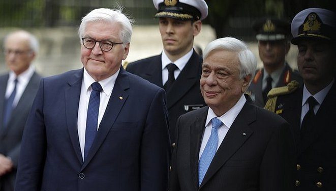 German President Frank-Walter Steinmeier, left, and his Greek counterpart Prokopis Pavlopoulos review the Presidential Guard during a welcome ceremony at the Presidential palace in Athens, Friday, April 7, 2017. Steinmeier is in Greece on a two-day official visit. (AP Photo/Thanassis Stavrakis)