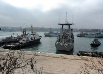 Russian ships block the Slavutych Ukrainian navy ship moored in Sevastopol bay on March 20, 2014. European leaders were on March 20 to debate biting economic sanctions against Russia for its annexation of Crimea as Ukraine tore up key ties with the Kremlin and drew up plans to evacuate its nationals from the rebel peninsula. AFP PHOTO/ VIKTOR DRACHEV        (Photo credit should read VIKTOR DRACHEV/AFP/Getty Images)