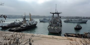 Russian ships block the Slavutych Ukrainian navy ship moored in Sevastopol bay on March 20, 2014. European leaders were on March 20 to debate biting economic sanctions against Russia for its annexation of Crimea as Ukraine tore up key ties with the Kremlin and drew up plans to evacuate its nationals from the rebel peninsula. AFP PHOTO/ VIKTOR DRACHEV        (Photo credit should read VIKTOR DRACHEV/AFP/Getty Images)