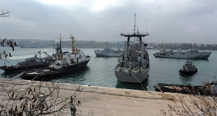 Russian ships block the Slavutych Ukrainian navy ship moored in Sevastopol bay on March 20, 2014. European leaders were on March 20 to debate biting economic sanctions against Russia for its annexation of Crimea as Ukraine tore up key ties with the Kremlin and drew up plans to evacuate its nationals from the rebel peninsula. AFP PHOTO/ VIKTOR DRACHEV        (Photo credit should read VIKTOR DRACHEV/AFP/Getty Images)