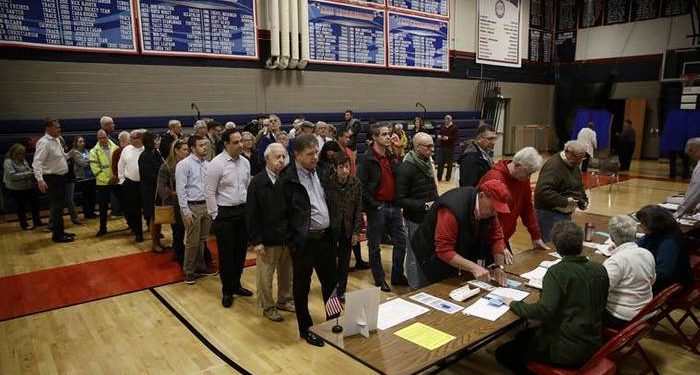 Voters line up to vote at a polling place in Doylestown, Pa., Tuesday, Nov. 6, 2018. (AP Photo/Matt Rourke)