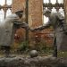 A resin sculpture, called "All Together Now", by artist Andrew Edwards, and depicting the Christmas Day football match between German and British soldiers fighting on the front line in World War One in 1914, is seen after being unveiled in the remains of St Luke's Church in Liverpool, northern England in this December 15, 2014 file photo. REUTERS/Phil Noble/Files