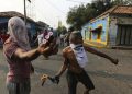 Opposition demonstrators clash with the Bolivarian National Guard in Urena, Venezuela, near the border with Colombia, Saturday, Feb. 23, 2019. Venezuela's National Guard fired tear gas on residents clearing a barricaded border bridge between Venezuela and Colombia on Saturday, heightening tensions over blocked humanitarian aid that opposition leader Juan Guaido has vowed to bring into the country over objections from President Nicolas Maduro(AP Photo/Fernando Llano)