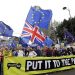 Demonstrators hold a banner during a Peoples Vote anti-Brexit march in London, Saturday, March 23, 2019. The march, organized by the People's Vote campaign is calling for a final vote on any proposed Brexit deal. This week the EU has granted Britain's Prime Minister Theresa May a delay to the Brexit process. (AP Photo/Kirsty Wigglesworth)