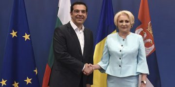 Greek Prime Minister Alexis Tsipras, left, shakes hands with his Romanian counterpart Viorica Dancila, during a meeting of the heads of government of Greece, Bulgaria, Romania and Serbia, at the northern port city of Thessaloniki , Greece, on Wednesday, July 4, 2018. (AP Photo/Giannis Papanikos)