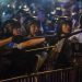 Riot police shout at protesters during clashes after a rally against a controversial extradition law proposal in Hong Kong on June 10, 2019. - Hong Kong witnessed its largest street protest in at least 15 years on June 9 as crowds massed against plans to allow extraditions to China, a proposal that has sparked a major backlash against the city's pro-Beijing leadership. (Photo by Philip FONG / AFP)