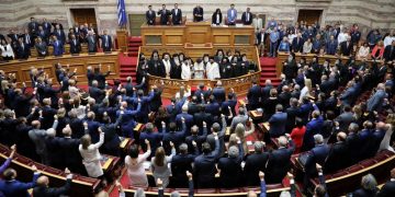 Leader of the Greek Orthodox church Archbishop Ieronimos blesses lawmakers during a swearing-in ceremony at the Greek parliament in Athens, Greece, July 17, 2019. REUTERS/Alkis Konstantinidis