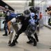 Policemen in riot gears arrest a protester during a demonstration at the Airport in Hong Kong, Tuesday, Aug. 13, 2019. Chaos has broken out at Hong Kong's airport as riot police moved into the terminal to confront protesters who shut down operations at the busy transport hub for two straight days. (AP Photo/Kin Cheung)