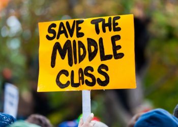 A protest sign reading "Save the Middle Class".