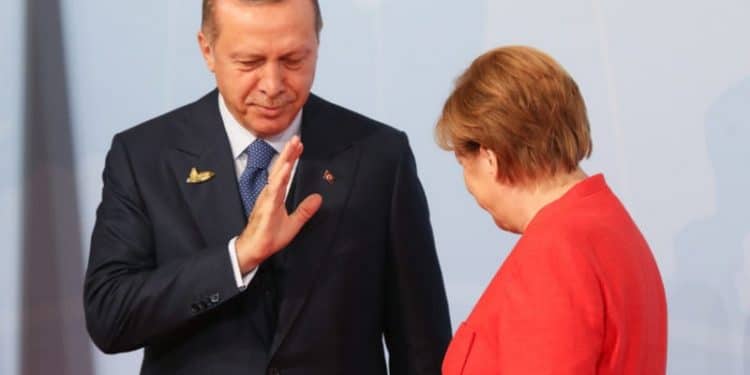 HAMBURG, GERMANY - JULY 07:  German Chancellor Angela Merkel (R) welcomes Turkish President Recep Tayyip Erdogan at the start of the the G20 summit on July 7, 2017 in Hamburg, Germany. Leaders of the G20 group of nations are meeting for the July 7-8 summit. Topics high on the agenda for the summit include climate policy and development programs for African economies.  (Photo by Matt Cardy/Getty Images)