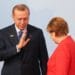 HAMBURG, GERMANY - JULY 07:  German Chancellor Angela Merkel (R) welcomes Turkish President Recep Tayyip Erdogan at the start of the the G20 summit on July 7, 2017 in Hamburg, Germany. Leaders of the G20 group of nations are meeting for the July 7-8 summit. Topics high on the agenda for the summit include climate policy and development programs for African economies.  (Photo by Matt Cardy/Getty Images)