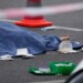 A covered body lies on the street after a car crashed into a crowd of people in central Berlin, Germany, Wednesday, May 8, 2022. (AP Photo/Michael Sohn)