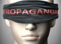 Propaganda can make things harder to see or makes us blind to the reality - pictured as word Propaganda on a blindfold to symbolize denial and that Propaganda can cloud perception, 3d illustration.