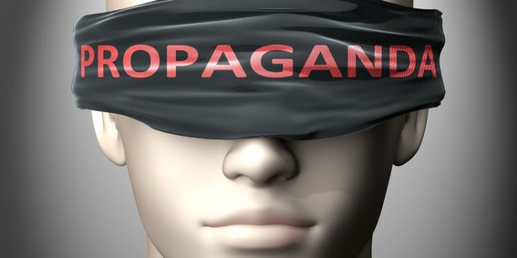 Propaganda can make things harder to see or makes us blind to the reality - pictured as word Propaganda on a blindfold to symbolize denial and that Propaganda can cloud perception, 3d illustration.