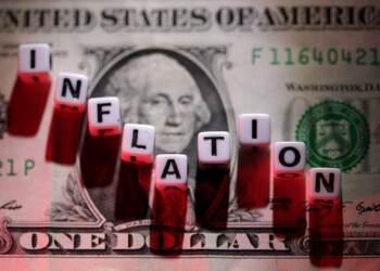 FILE PHOTO: Plastic letters arranged to read "Inflation" are placed on U.S. dollar banknote in this illustration taken, June 12, 2022. REUTERS/Dado Ruvic/Illustration