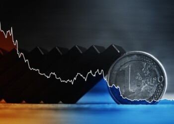 Falling sparkline chart, fallen dominoes and euro coin. Concept of financial crisis and economy collapse in European Union.