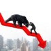Businessman against black bear on red arrow downward trend line with sky cityscape background. Fight back bearish market concept.