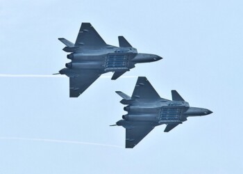 FILE PHOTO: Chengdu J-20 stealth fighter jets of Chinese People's Liberation Army (PLA) Air Force perform with open weapon bays during the China International Aviation and Aerospace Exhibition, or Zhuhai Airshow, in Zhuhai, Guangdong province, China November 11, 2018. REUTERS/Stringer