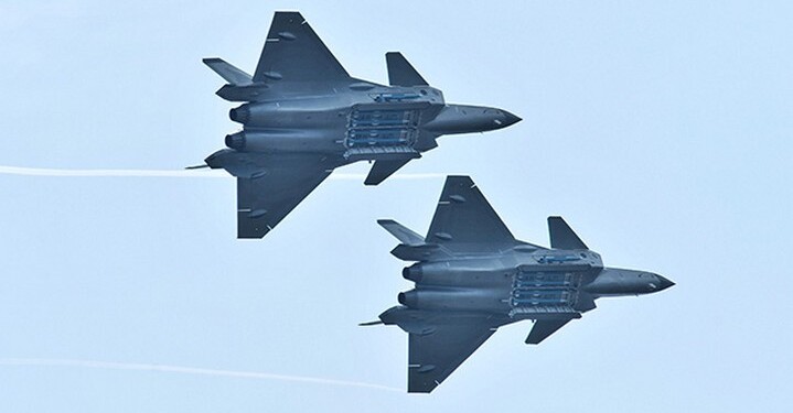 FILE PHOTO: Chengdu J-20 stealth fighter jets of Chinese People's Liberation Army (PLA) Air Force perform with open weapon bays during the China International Aviation and Aerospace Exhibition, or Zhuhai Airshow, in Zhuhai, Guangdong province, China November 11, 2018. REUTERS/Stringer