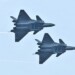 FILE PHOTO: Chengdu J-20 stealth fighter jets of Chinese People's Liberation Army (PLA) Air Force perform with open weapon bays during the China International Aviation and Aerospace Exhibition, or Zhuhai Airshow, in Zhuhai, Guangdong province, China November 11, 2018. REUTERS/Stringer