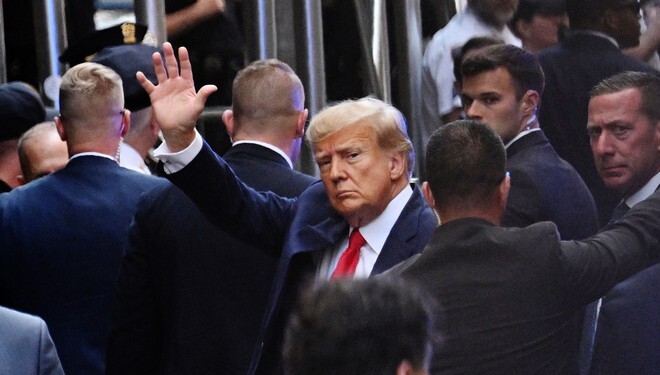 Former US president Donald Trump arrives ahead of his arraignment at the Manhattan Federal Court in New York City on April 4, 2023. - Former US President Donald Trump is to be booked, fingerprinted, and will have a mugshot taken at a Manhattan courthouse on the afternoon of April 4, 2023, before appearing before a judge as the first ever American president to face criminal charges. (Photo by ANDREW CABALLERO-REYNOLDS / AFP) (Photo by ANDREW CABALLERO-REYNOLDS/AFP via Getty Images)