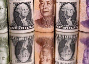 FILE PHOTO: Chinese Yuan and U.S. dollar banknotes are seen in this illustration taken February 10, 2020. REUTERS/Dado Ruvic/Illustration/File Photo