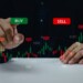 Finance graph with a businessman hand touching a button Stock market exchange future analysis investment forex virtual screen Business digital interface technology concept.