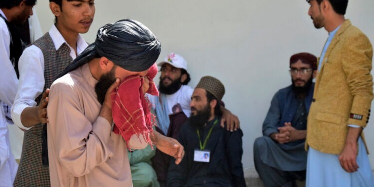 People mourn for their relative, who was killed in a bomb explosion, at a hospital, in Quetta, Pakistan, Friday, Sept. 29, 2023. A powerful bomb exploded at a rally celebrating the birthday of Islam's Prophet Muhammad in southwest Pakistan on Friday, killing multiple people and wounding dozens of others, police and a government official said. (AP Photo/Arshad Butt)