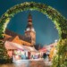 Riga, Latvia. Traditional Christmas Market On Dome Square With Riga Dome Cathedral. Famous Landmark In Winter Evening Night In Festive Illuminations Lighting