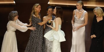 epa11213404 Emma Stone (3-R) is handed the Oscar for Best Actress In A Leading Role from Jennifer Lawrence (2-L) as Sally Field (L) Michelle Yeoh (3-L) Charlize Theron (2-R) and Jessica Lange (R) look on during the 96th annual Academy Awards ceremony at the Dolby Theatre in the Hollywood neighborhood of Los Angeles, California, USA, 10 March 2024. The Oscars are presented for outstanding individual or collective efforts in filmmaking in 23 categories.  EPA/CAROLINE BREHMAN