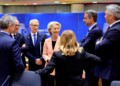 European Commission President Ursula von der Leyen, center left, speaks with from left, Slovenia's Prime Minister Robert Golob, Luxembourg's Prime Minister Luc Frieden, Bulgaria's Prime Minister Nikolai Denkov, Greece's Prime Minister Kyriakos Mitsotakis and Austria's Chancellor Karl Nehammer during a round table meeting at an EU Summit in Brussels, Thursday, March 21, 2024. European Union leaders are gathering to consider new ways to help boost arms and ammunition production for Ukraine. Leaders will also discuss in Thursday's summit the war in Gaza amid deep concern about Israeli plans to launch a ground offensive in the city of Rafah. (AP Photo/Geert Vanden Wijngaert)