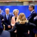 European Commission President Ursula von der Leyen, center left, speaks with from left, Slovenia's Prime Minister Robert Golob, Luxembourg's Prime Minister Luc Frieden, Bulgaria's Prime Minister Nikolai Denkov, Greece's Prime Minister Kyriakos Mitsotakis and Austria's Chancellor Karl Nehammer during a round table meeting at an EU Summit in Brussels, Thursday, March 21, 2024. European Union leaders are gathering to consider new ways to help boost arms and ammunition production for Ukraine. Leaders will also discuss in Thursday's summit the war in Gaza amid deep concern about Israeli plans to launch a ground offensive in the city of Rafah. (AP Photo/Geert Vanden Wijngaert)