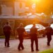 Police officers walk toward the scene of the mass shooting at the Pulse nightclub early Tuesday, June 14, 2016, in Orlando, Fla. (AP Photo/David Goldman)