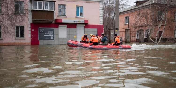 Emergency workers and police ride a boat during evacuations in a flooded street after parts of a dam burst, in Orsk, Russia on Monday, April 8, 2024. Floods caused by rising water levels in the Ural River broke a dam in a city near Russia's border with Kazakhstan, forcing some 2,000 people to evacuate, local authorities said. The dam broke in the city of Orsk in the Orenburg region, less than 12.4 miles north of the border on Friday night, according to Orsk mayor Vasily Kozupitsa. (AP Photo)