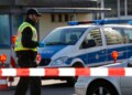 A German police officer checks vehicles at the German-France border in Kehl, Monday March 16, 2020. Germany partially closes its borders with France, Switzerland, Austria, Luxembourg and Denmark as it steps up efforts to stem the spread of the new coronavirus. For most people, the new coronavirus causes only mild or moderate symptoms. For some it can cause more severe illness. (AP Photo/Jean-Francois Badias)