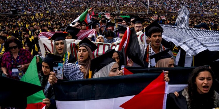 ANN ARBOR, MICHIGAN - MAY 4: Students demonstate during a Pro-Palestinian protest during the University of Michigan's spring commencement ceremony on May 4, 2024 at Michigan Stadium in Ann Arbor, Michigan. A group of students called for the University of Michigan to divest from companies with ties to Israel during the spring commencement ceremony.   Nic Antaya/Getty Images/AFP (Photo by Nic Antaya / GETTY IMAGES NORTH AMERICA / Getty Images via AFP)