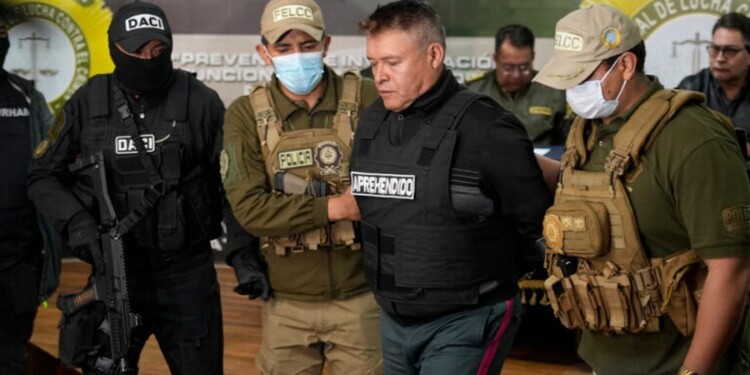 Bolivian police hold the detained Juan Jose Zuniga, former general commander of the Army, in La Paz, Bolivia, Wednesday, June 26, 2024. An apparent failed coup attempt erupted Wednesday in the country, and Zuniga appeared to be leading the rebellion. (AP Photo/Juan Karita)