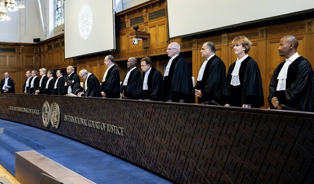 (From R) South African Judge Dire Tladi, US Judge Sarah Cleveland, Brazilian Judge Leonardo Nemer Caldeira Brant, German Judge Georg Nolte, Idian Judge Dalveer Bhandari, Somali Judge Abdulqawi Yusuf, Slovak Judge Peter Tomka, Lebanese Judge and President of the International Court of Justice (ICJ) Nawaf Salam, Ugandan Judge and 
Vice-President of the International Court of Justice Julia Sebutinde, French Judge Ronny Abraham, Chinese Judge Xue Hanqin, Japanese Judge Yuji Iwasawa, Australian Judge Hilary Charlesworth, Mexican Judge Juan Manuel Gomez Robledo, Romanian Judge Bogdan Lucian Aurescu rise before delivering a non-binding ruling on the legal consequences of the Israeli occupation of the West Bank and East Jerusalem at the International Court of Justice (ICJ) in The Hague on July 19, 2024. - The UN's top court handed down its view, on July 19, 2024, declaring "illegal" Israel's occupation of Palestinian territories since 1967, amid growing international pressure over the war in Gaza. (Photo by Nick Gammon / AFP)