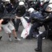 Police forces  clash with counter demonstrators during a rally of the group 'Austrian protesters against migrants'  in Vienna, Austria, Saturday, June 11, 2016. (AP Photo/Ronald Zak)