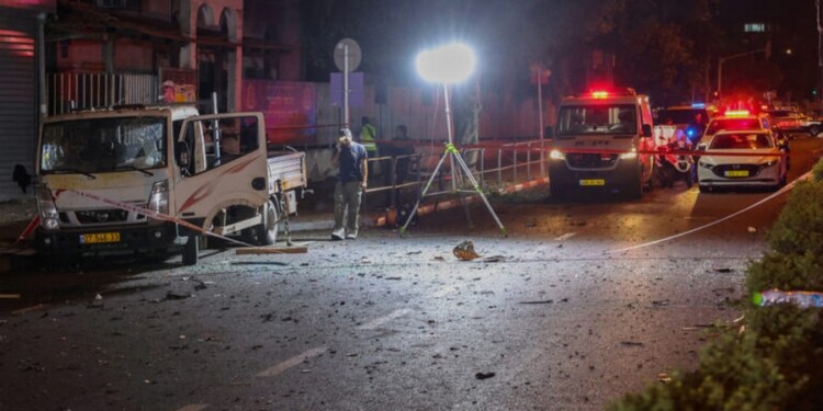 Israeli security and emergency personnel cordon off the site of an explosion in Tel Aviv on August 18, 2024. (Photo by Jack GUEZ / AFP)