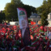 A picture of Hamas leader Ismail Haniyeh, who was killed in Tehran is carried amid of demonstrators waving Palestinian and Turkish flags during a rally in support of Palestinians in Gaza, in Istanbul, Turkey, Saturday, Aug. 3, 2024. (AP Photo/Khalil Hamra)