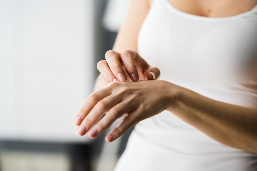 Woman Scratching Itching Body Skin With Allergy