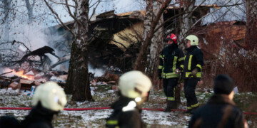 Emergency services at the DHL cargo plane crash site near Vilnius International Airport on Nov. 25. Photographer: Petras Malukas/AFP/Getty Images