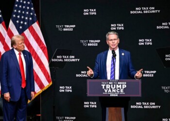 Republican presidential nominee former President Donald Trump, left, listens as investor Scott Bessent speaks on the economy in Asheville, N.C., Wednesday, Aug. 14, 2024. (AP Photo/Matt Kelley)