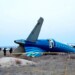 In this photo taken from a video released by the administration of Mangystau region, a part of Azerbaijan Airlines' Embraer 190 lies on the ground near the airport of Aktau, Kazakhstan, on Thursday, Dec. 26, 2024. (The Administration of Mangystau Region via AP)