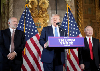 Donald Trump delivers remarks alongside Howard Lutnick, left, and Masayoshi Son at the Mar-a-Lago resort in Palm Beach, Florida, on Dec. 16. Photographer: Andrew Harnik/Getty Images