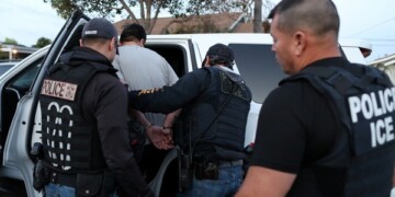 ICE Field Office Director, Enforcement and Removal Operations, David Marin and U.S. Immigration and Customs Enforcement's (ICE) Fugitive Operations team arrest a Mexican national at a home in Paramount, California, U.S., March 1, 2020. REUTERS/Lucy Nicholson